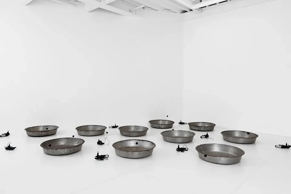 Zimoun — installation with motors, cotton balls and metal bowls